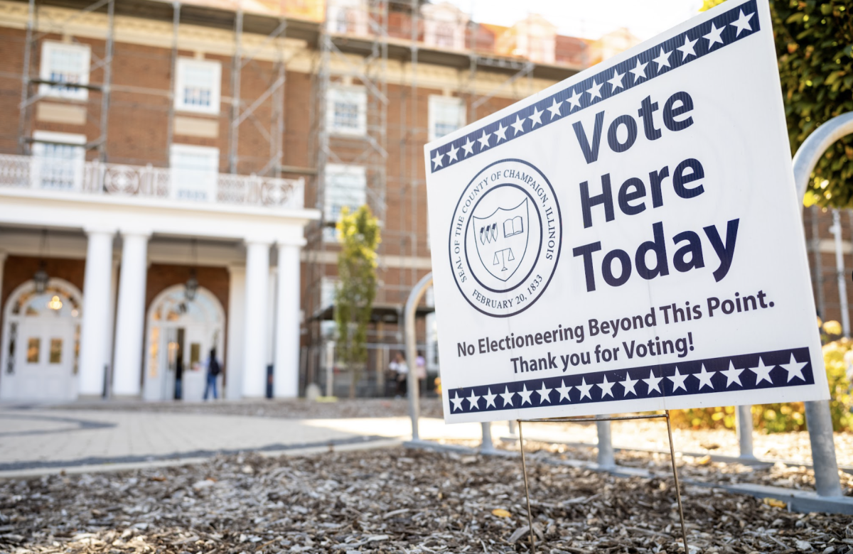 "Vote Here Today" signs in front of Illini Union on Oct 24 encouraging eligible students to vote.